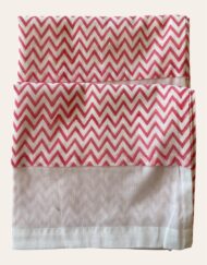 Hand block printed pink zig zag pillowcases lined with white voile